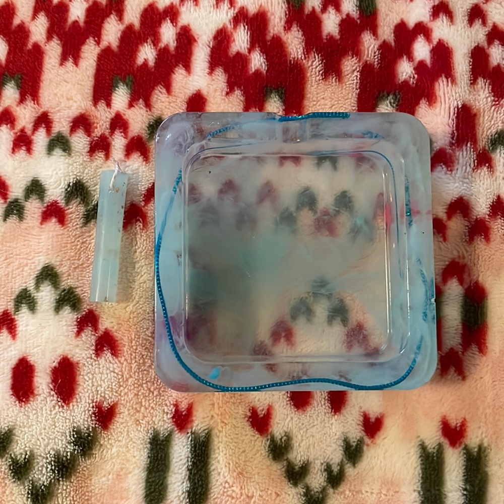 Cute charm and ashtray.